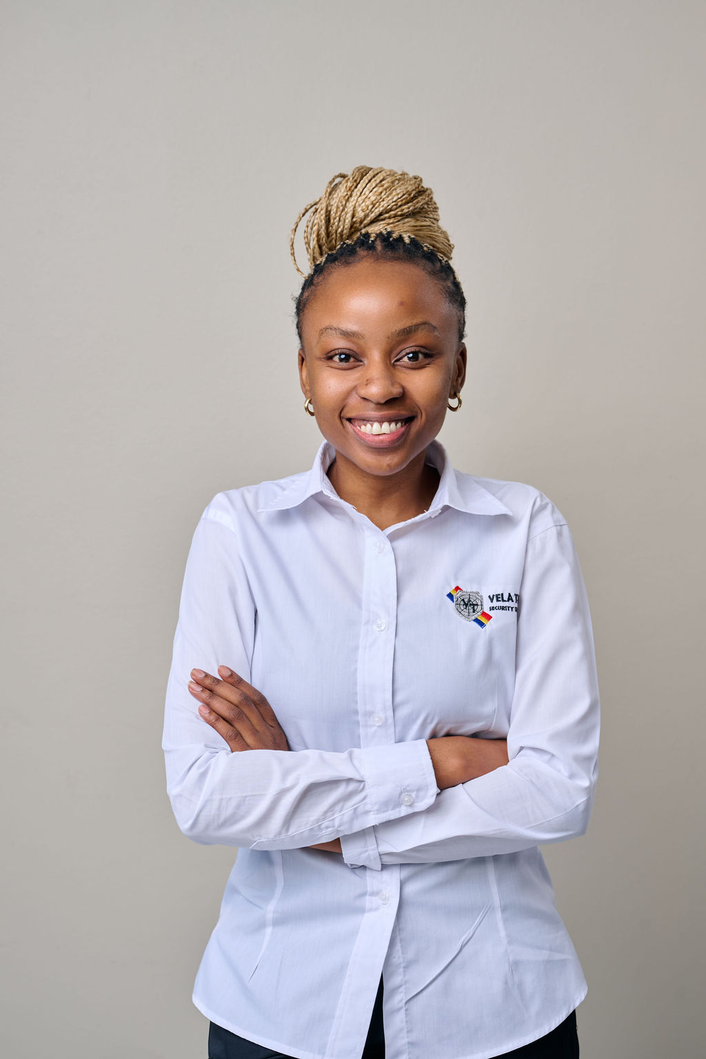 A Vela-Tech Security head office staff member in uniform