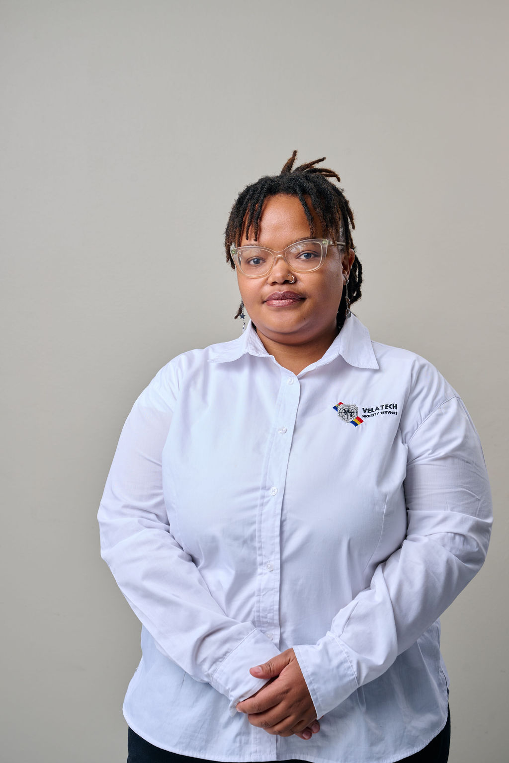 A Vela-Tech Security head office staff member in uniform